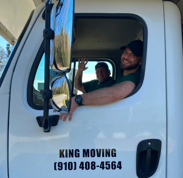 happy movers in a truck
